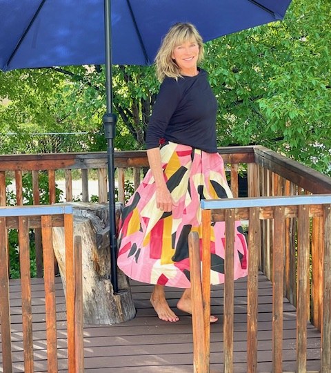 Michele Potter on a wooden deck in Taos, New Mexico.
